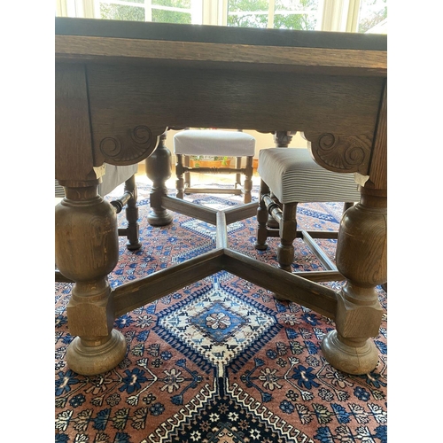 7 - A WONDERFUL SOLID OAK DINING TABLE ALONG WITH CHAIRS, table with turned legs, carving to frieze, tur... 