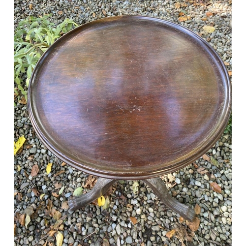 77 - AN ANTIQUE MAHOGANY WINE TABLE, with circular top, turned column with scroll supports, atop tripod b... 