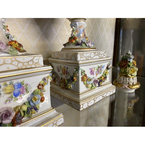 80 - A PAIR OF ORNATE MEISSEN PORCELAIN URN VASES ON PLYNTHS, classical urn form, finely decorated with p... 