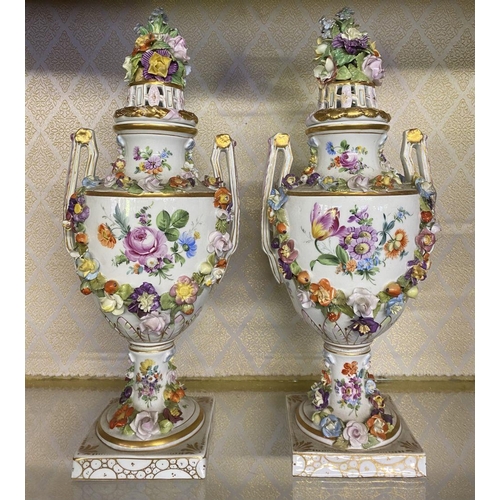 80 - A PAIR OF ORNATE MEISSEN PORCELAIN URN VASES ON PLYNTHS, classical urn form, finely decorated with p... 