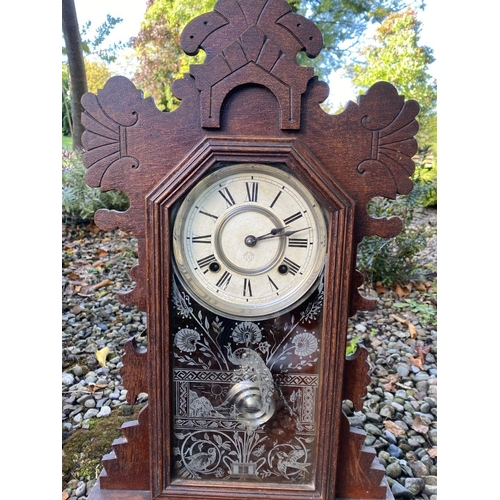 81 - A VINTAGE ANSONIA GINGERBREAD MANTLE CLOCK, in fine carved hardwood case, with wonderful etched glas... 