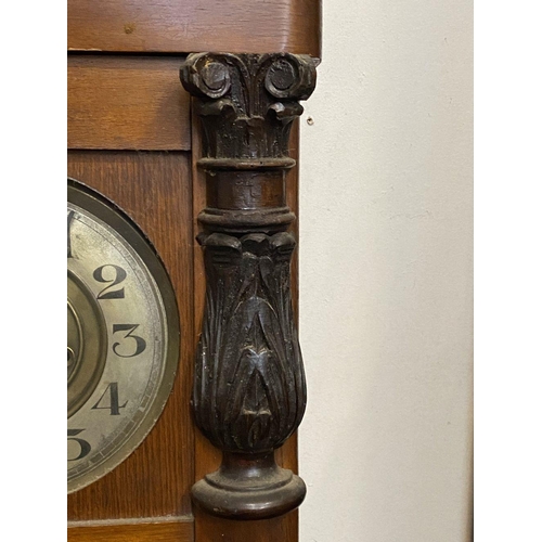 85 - AN ANTIQUE MAHOGANY WALL CLOCK, rectangular form, with carving to cornice, column carvings to either... 