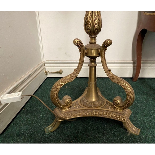 86 - A DECORATIVE GILT FLOOR LAMPSHADE, with turned engraved column on shaped tripod base supported by sc... 