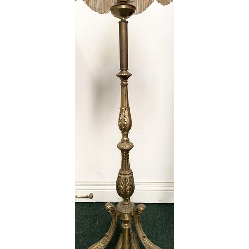 86 - A DECORATIVE GILT FLOOR LAMPSHADE, with turned engraved column on shaped tripod base supported by sc... 