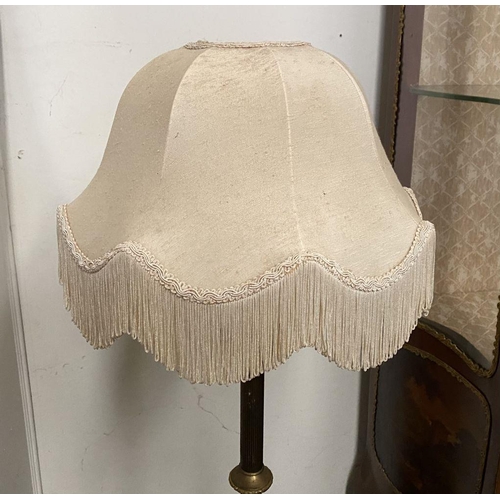 86 - A DECORATIVE GILT FLOOR LAMPSHADE, with turned engraved column on shaped tripod base supported by sc... 