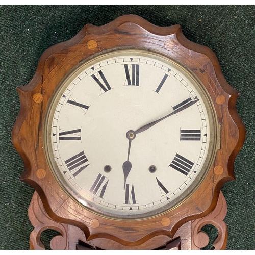 88 - A VINTAGE ORNATE AMERICAN WALL CLOCK, with white dial and roman numerals to clock face, shaped frame... 