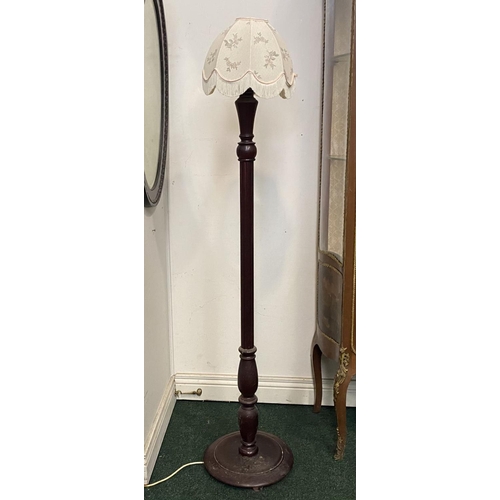 94 - AN ANTIQUE MAHOGANY FLOOR LAMP, with turned support on circular base, complete with lampshade with f... 