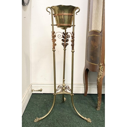 95 - A VICTORIAN BRASS WASH STAND, with decorative scroll and foliage design to legs, supported by finial... 