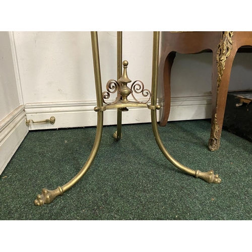 95 - A VICTORIAN BRASS WASH STAND, with decorative scroll and foliage design to legs, supported by finial... 