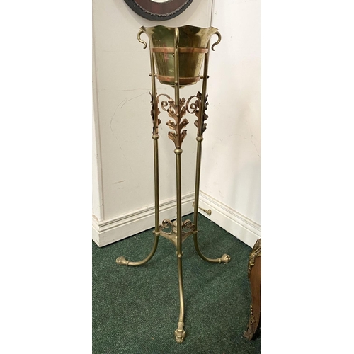 95 - A VICTORIAN BRASS WASH STAND, with decorative scroll and foliage design to legs, supported by finial... 