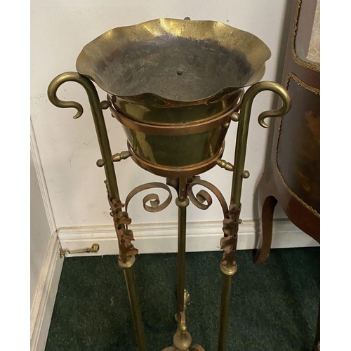 95 - A VICTORIAN BRASS WASH STAND, with decorative scroll and foliage design to legs, supported by finial... 