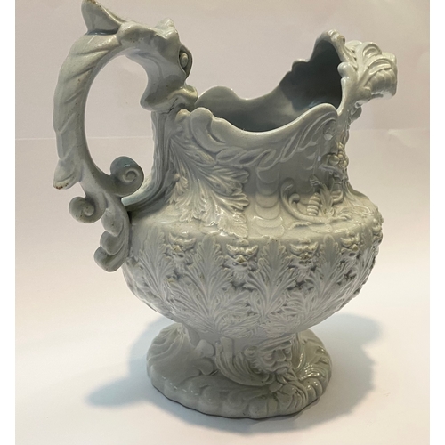 333 - AN ANTIQUE STAFFORDSHIRE FIGURAL MASK JUG, with dragon design handle, foliage design surrounding. Di... 