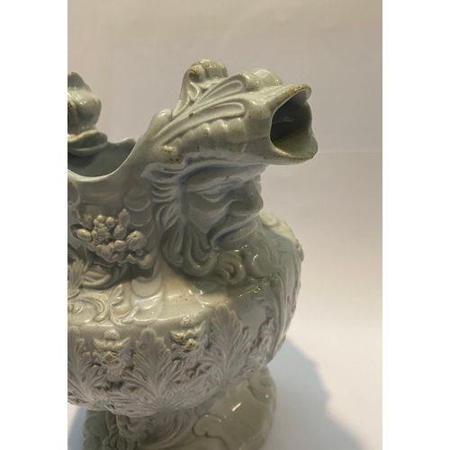 333 - AN ANTIQUE STAFFORDSHIRE FIGURAL MASK JUG, with dragon design handle, foliage design surrounding. Di... 