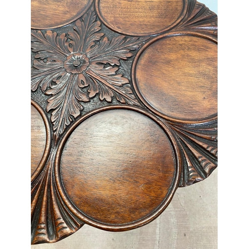 1 - A VERY BEAUTIFUL IRISH MAHOGANY SUPPER TABLE, the stunning table top has six carved dish roundels wh... 