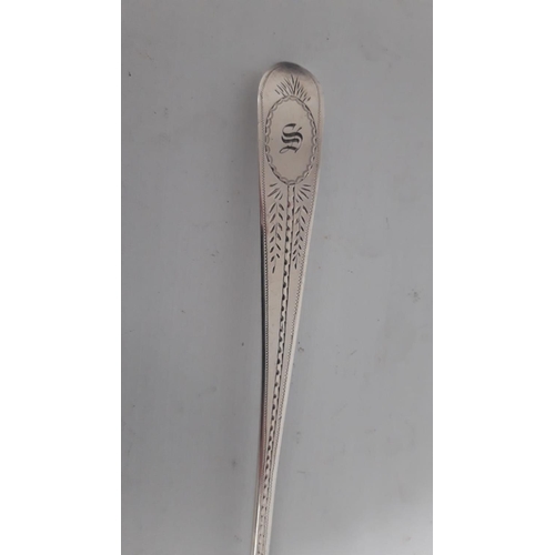 20 - A VERY FINE IRISH GEORGIAN SILVER BASTING SPOON, beautifully decorated with bright cut engraving to ... 