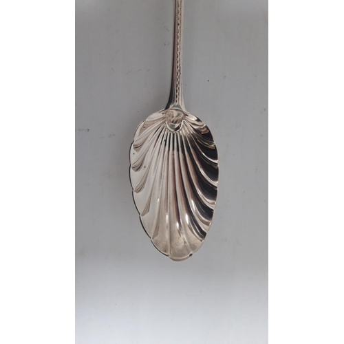 20 - A VERY FINE IRISH GEORGIAN SILVER BASTING SPOON, beautifully decorated with bright cut engraving to ... 