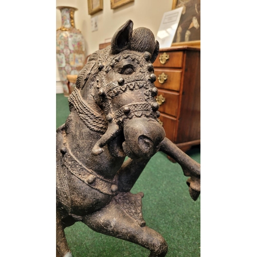25 - AN ANTIQUE LARGE HEAVY CAST METAL HORSE & RIDER SCULPTURE, possibly African or Indian, in the Benin ... 