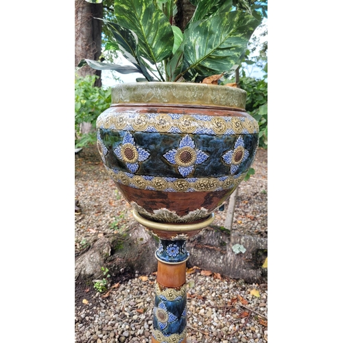 31 - A VERY GOOD QUALITY ROYAL DOULTON JARDINERÉ POT & STAND, the pot with floral design having foliage d... 