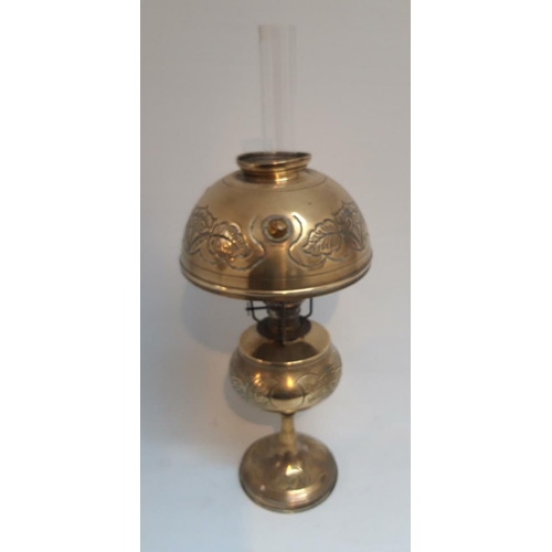 45 - A VICTORIAN FRENCH BRASS OIL LAMP, the shade with inset amber coloured cut glass beads & decorated w... 