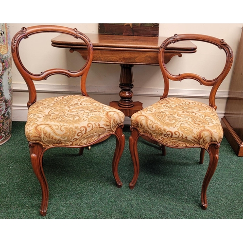 53 - A VERY GOOD PAIR OF VICTORIAN BALLOON BACK CHAIRS, each with carved acanthus leaf detail to the curv... 