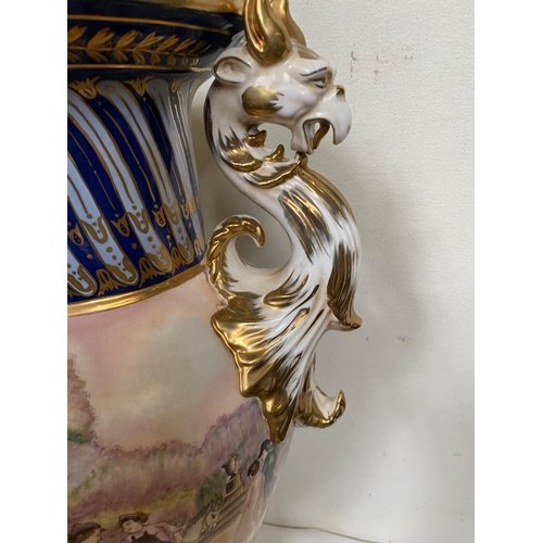 59 - A PAIR OF CONTINENTAL PROCELAIN VASE URNS, each with a pair of dragon handles to the sides, the neck... 