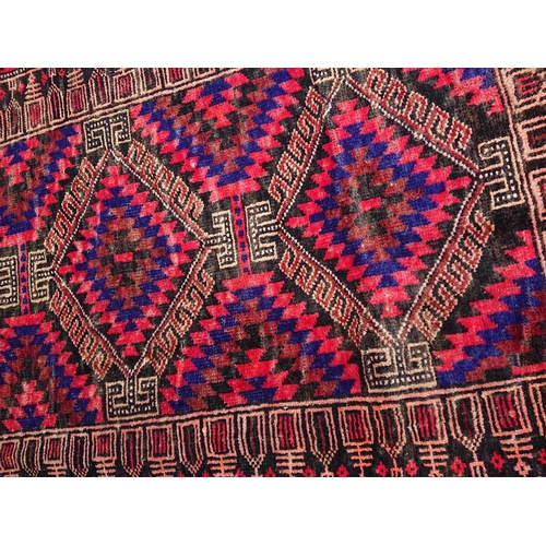 6 - A VIBRANT PERSIAN BELOUCH RUG, material: hand spun wool with natural organic dyes; design: this rug ... 