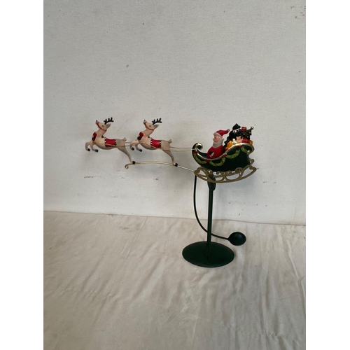 243 - **WITHDRAWN**

A ROCKING PENDULUM CHRISTMAS ORNAMENT, depicting Santa in sleigh, dimensions: 45cm x ... 