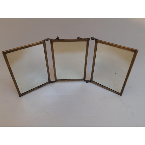 101 - A VICTORIAN THREE PANEL FOLDING TRAVELLING MIRROR, with tooled leather backing, 33 x 14cm when open.... 