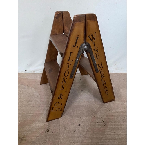 110 - A TWO STEP DISPLAY LADDER with lettering to the sides ‘J. Lyons & Co. Ltd – Wine Merchants’, great h... 