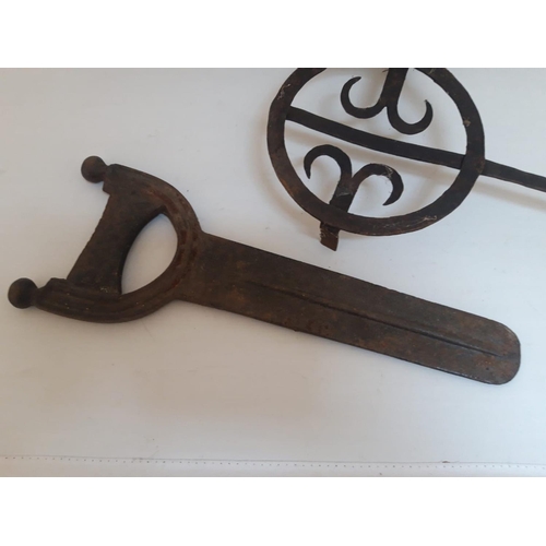 111 - AN INTERESTING LOT: A GEORGIAN CAST IRON BOOK SCRAPER & AN 18TH CENTURY IRON TRIVET, scraper is 46cm... 