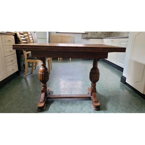 116 - A GOOD OAK EXTENDABLE REFECTORY STYLE DINING TABLE, with two leaves that are stored within the table... 