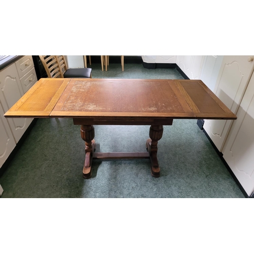 116 - A GOOD OAK EXTENDABLE REFECTORY STYLE DINING TABLE, with two leaves that are stored within the table... 