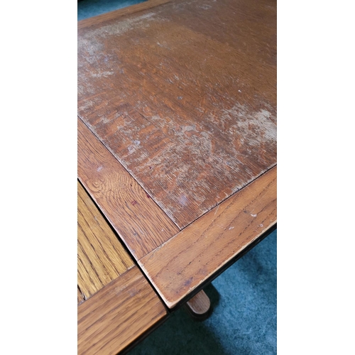 116 - A GOOD OAK EXTENDABLE REFECTORY STYLE DINING TABLE, with two leaves that are stored within the table... 