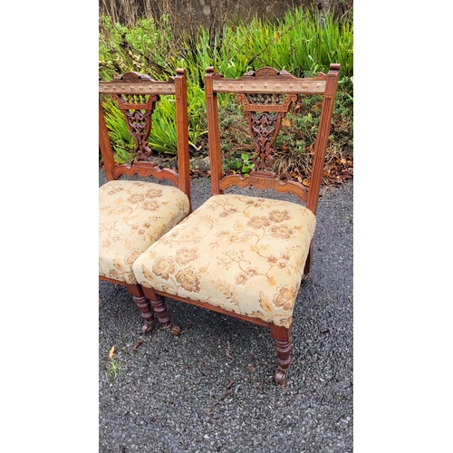 117 - A LOVELY PAIR OF EDWARDIAN LOW RISE ‘NURSING’ / BEDROOM CHAIRS, each with a carved & pierced back re... 