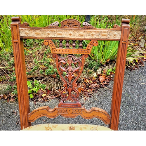 117 - A LOVELY PAIR OF EDWARDIAN LOW RISE ‘NURSING’ / BEDROOM CHAIRS, each with a carved & pierced back re... 