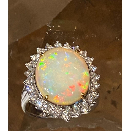 12 - A UNIQUE 18CT WHITE GOLD AUSTRALIAN FIRE OPAL & DIAMOND RING, opal weight: 4.07cts, surrounded by 1.... 