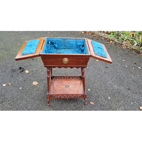 126 - AN EDWARDIAN SARCOPAGUS SHAPED WORKS TABLE, the top has a pair of hinged doors that are nicely decor... 