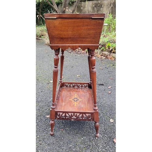 126 - AN EDWARDIAN SARCOPAGUS SHAPED WORKS TABLE, the top has a pair of hinged doors that are nicely decor... 