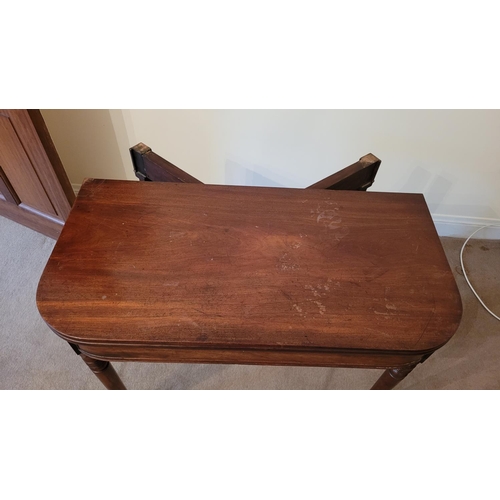 127 - A GOOD QUALITY 19TH CENTURY MAHOGANY FOLD OVER TEA TABLE, with cockbead detail to the frieze, canted... 