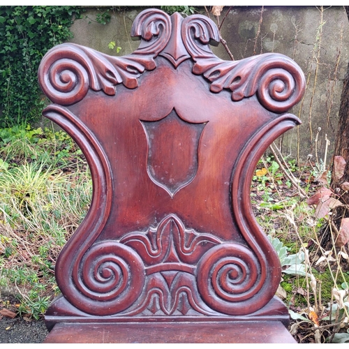 128 - A VERY FINE SINGLE LATE 19TH CENTURY MAHOGANY HALL CHAIR, with a carved shield shaped back that is c... 