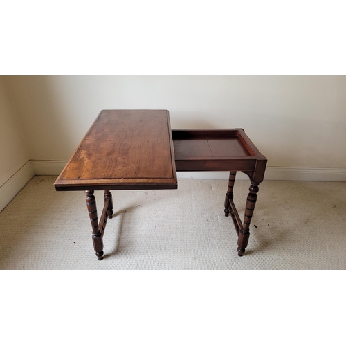 129 - AN ANTIQUE MAHOGANY FOLD OVER CARD TABLE, the top with a graduated edge that meets the frame beneath... 