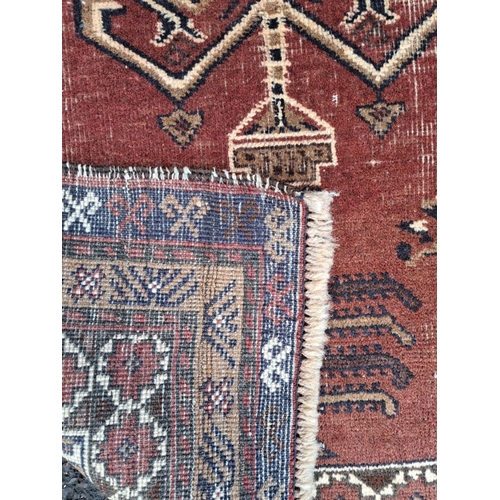 153 - A GOOD QUALITY AFGHAN BALOUCH TREE OF LIFE FLOOR RUG, with lovely detail to the centre panel showing... 