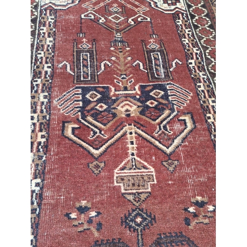 153 - A GOOD QUALITY AFGHAN BALOUCH TREE OF LIFE FLOOR RUG, with lovely detail to the centre panel showing... 