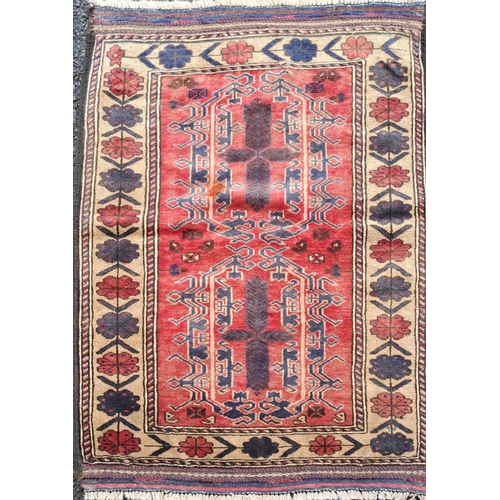 16 - A GOOD QUALITY AFGHAN BELOUCH FLOOR RUG, with deep floral border with a rope design border on each s... 