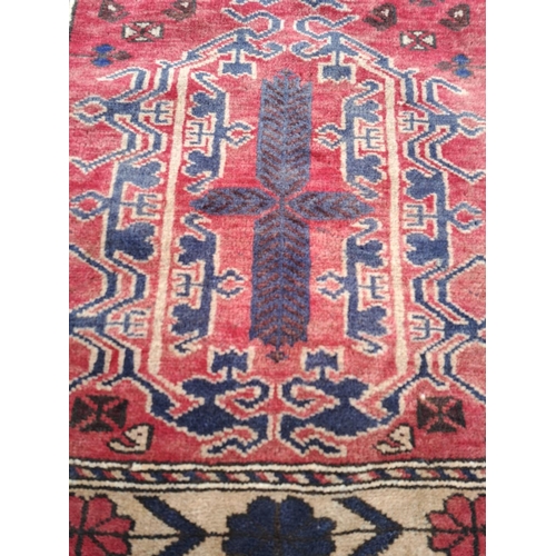 16 - A GOOD QUALITY AFGHAN BELOUCH FLOOR RUG, with deep floral border with a rope design border on each s... 