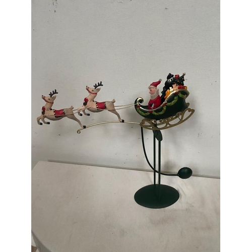 161 - A DELIGHTFUL CHRISTMAS TABLE / WINDOW CILL DECORATION, with Santa seated in his green sleigh and two... 