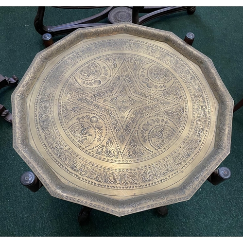 169 - AN ANTIQUE ANGLO/INDIAN FOLDING SIDE TABLE, decorative brass embossed shaped top with raised border,... 