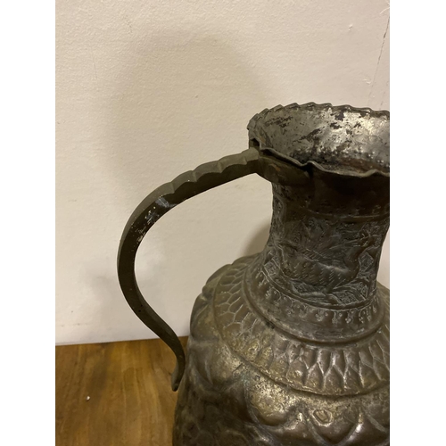 184 - AN EXCELLENT ANTIQUE MIDDLE EASTERN COPPER WATER PITCHER, with curved handle attached to shaped rim,... 