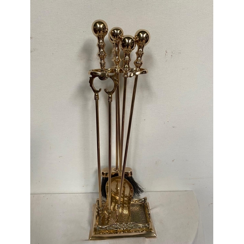 187 - A VERY GOOD QUALITY SET OF POLISHED BRASS FIRE IRONS, with stand, includes a shovel, brush, poker & ... 