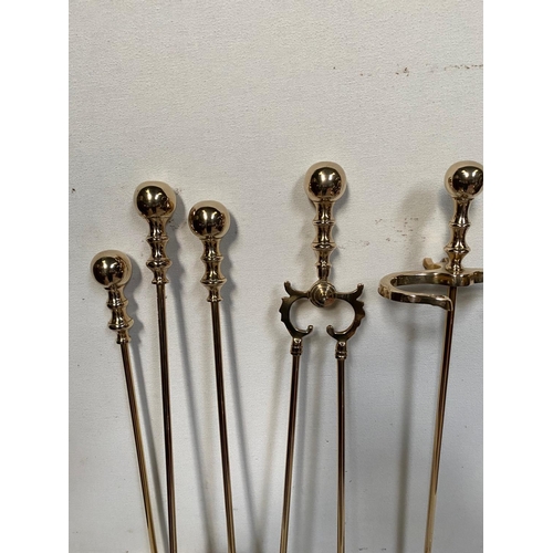 187 - A VERY GOOD QUALITY SET OF POLISHED BRASS FIRE IRONS, with stand, includes a shovel, brush, poker & ... 